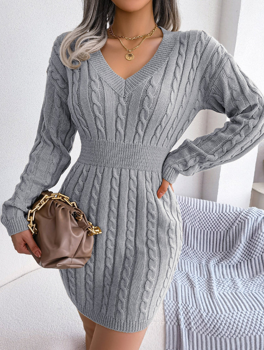 Grey cable-knit waist-hugging hip dress by FJØRNA, featuring a stylish and comfortable fit with a fitted silhouette.