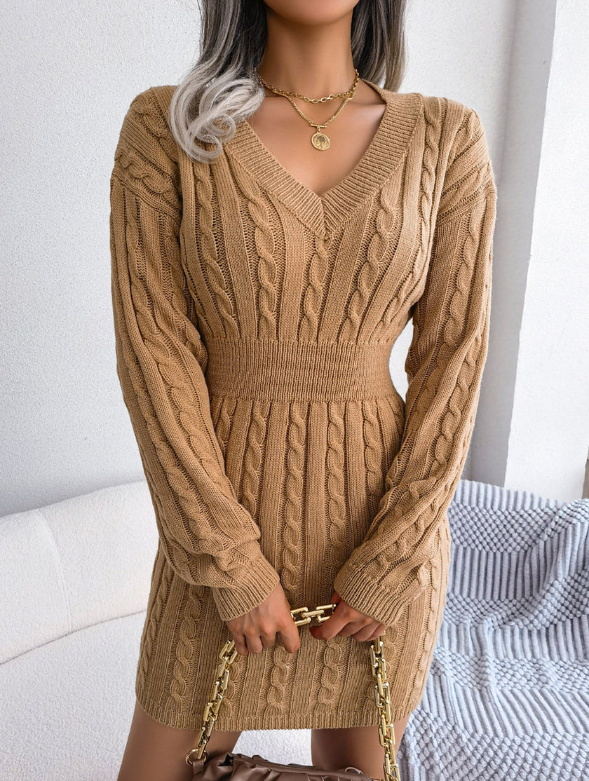 White cable-knitted waist-hugging hip dress by FJØRNA, showcasing a stylish, form-fitting design with a cozy knit texture.