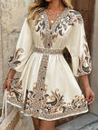 FJØRNA printed white V-neck three-quarter sleeve tie-waist dress, casual and stylish, shown on a model.