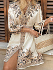 FJØRNA white printed V-neck three-quarter sleeve tie-waist dress displayed on a hanger, showcasing its stylish design and fabric details.