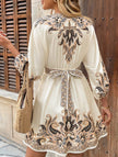 FJØRNA printed white V-neck three-quarter sleeve tie-waist dress, stylish and elegant for casual or semi-formal wear.