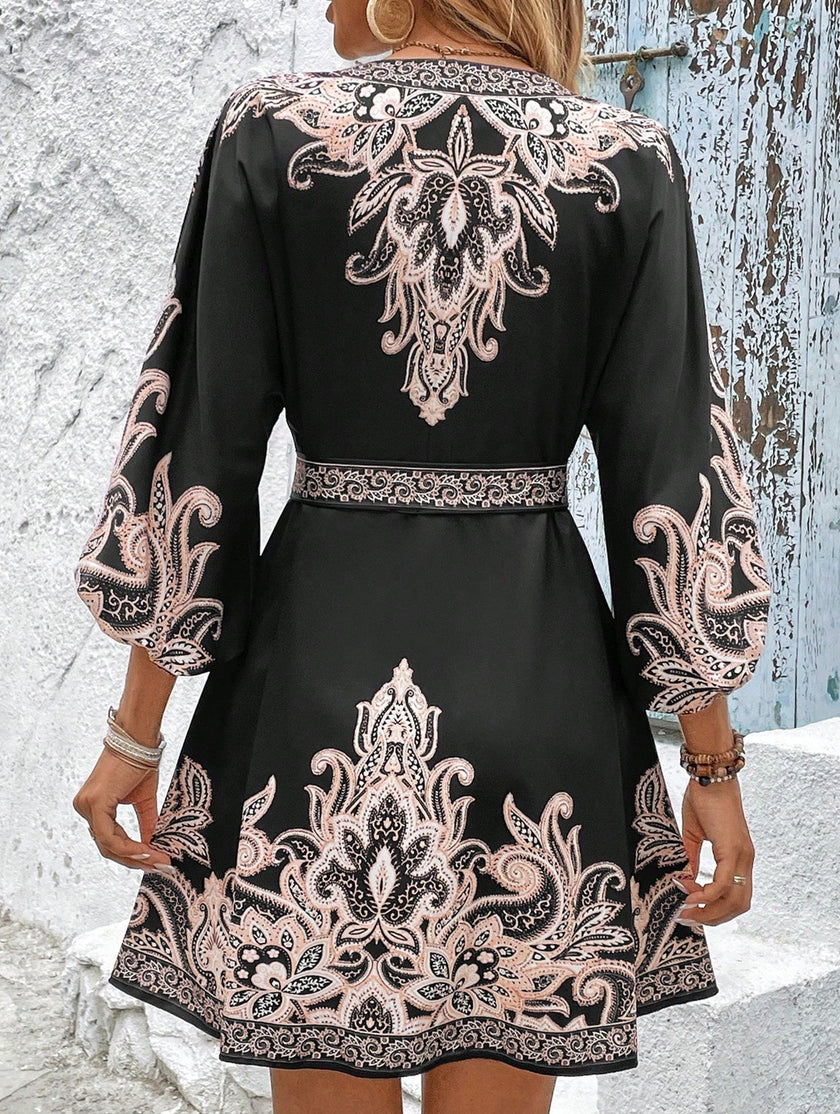 FJØRNA printed V-neck three-quarter sleeve tie-waist dress in white, shown with a stylish silhouette and elegant design.