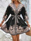 FJØRNA printed V-neck three-quarter sleeve tie-waist dress in white, featuring a stylish design and elegant fit.
