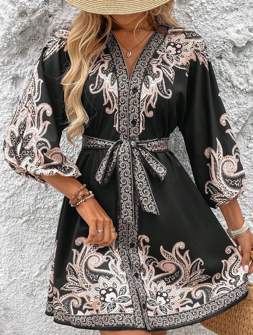 FJØRNA printed white V-neck three-quarter sleeve tie-waist dress displayed on a hanger.