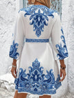 FJØRNA printed V-neck three-quarter sleeve tie-waist dress in white, featuring a stylish and comfortable design.