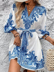 FJØRNA white printed V-neck dress with three-quarter sleeves and tie waist, perfect for casual or semi-formal occasions.