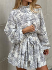 FJØRNA retro lace-up print dress in white, featuring a vintage-inspired design with lace-up front and classic silhouette.