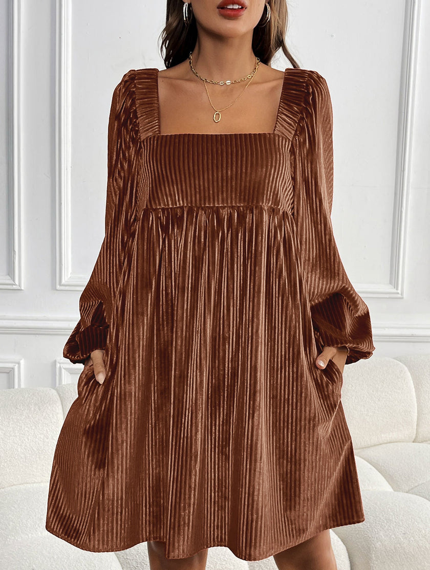 White FJØRNA loose square neck halter dress displayed on a hanger, showcasing its relaxed fit and elegant design.