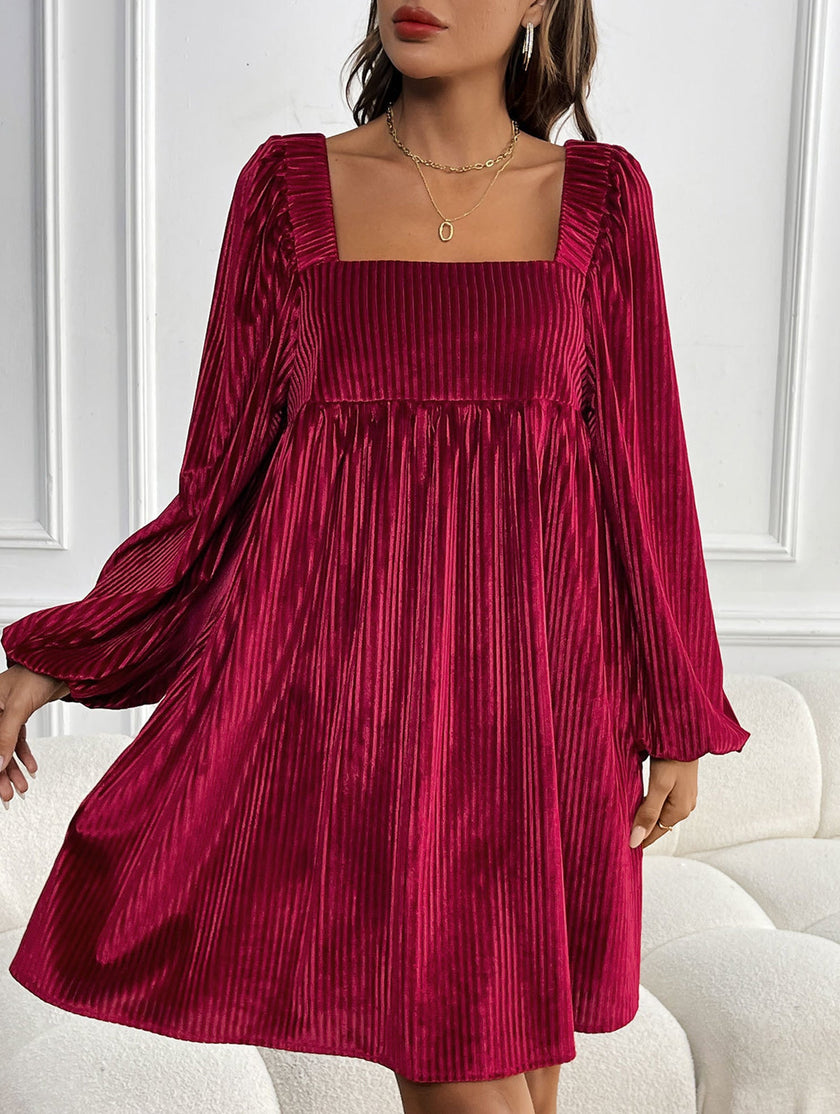 White FJØRNA loose square neck halter dress displayed on a hanger, showcasing its relaxed fit and stylish design.