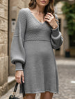 Grey V-neck puff sleeve knitted sweater dress by FJØRNA, featuring a solid color and a stylish, cozy design.