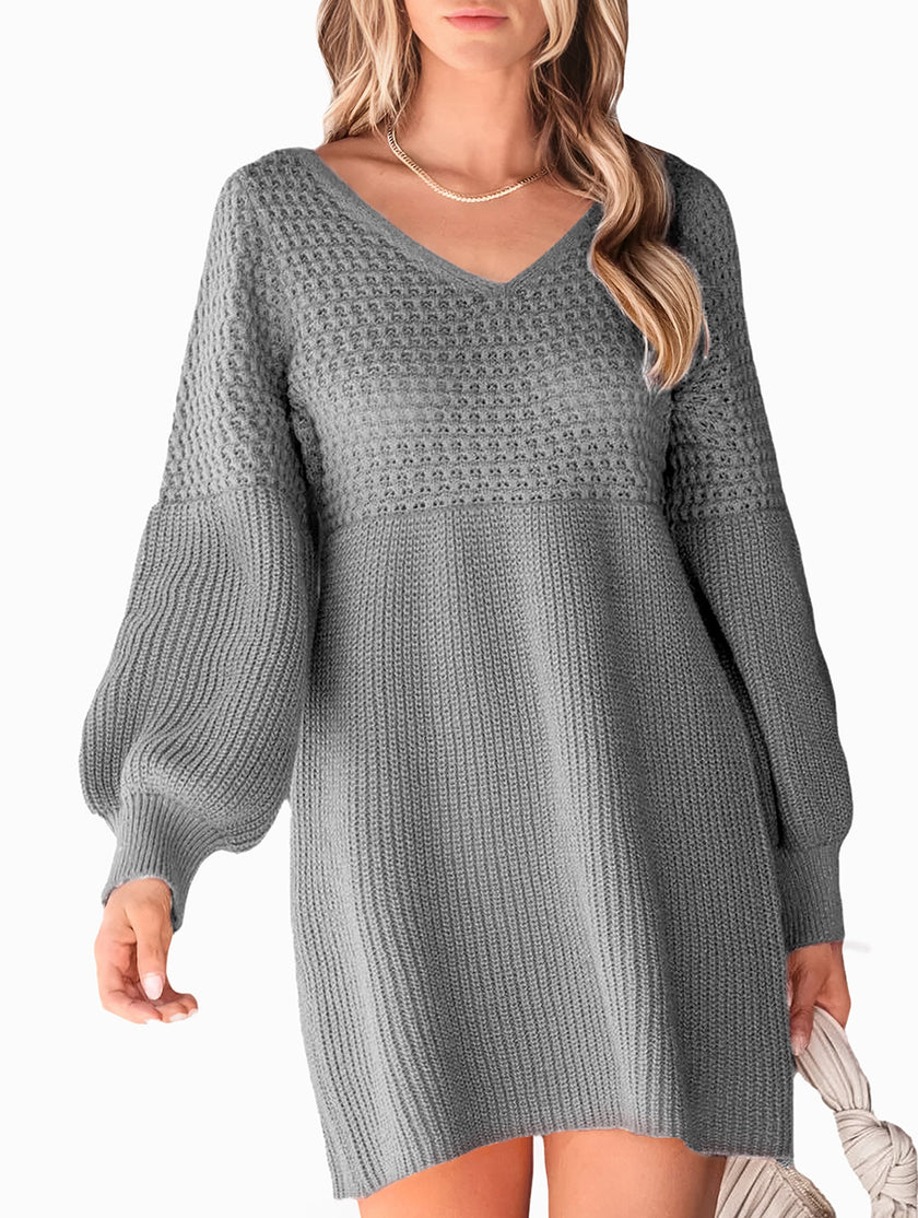 Grey V-neck puff sleeve knitted sweater dress by FJØRNA, featuring solid color design and cozy, stylish fit.