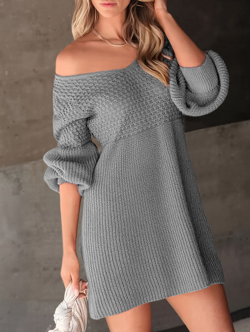 Grey V-neck puff sleeve knitted sweater dress by FJØRNA with solid color design, featuring a relaxed fit and cozy texture.