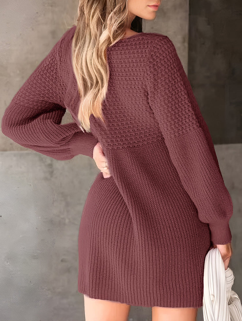 White FJØRNA V-neck puff sleeve knitted sweater dress showcasing a fitted silhouette and solid color design.