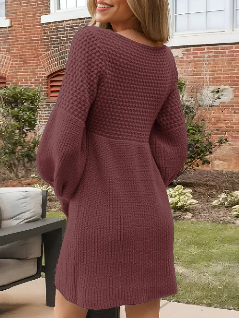 White V-neck puff sleeve knitted sweater dress by FJØRNA, showcasing a stylish solid color design and cozy fit.
