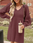 White V-neck puff sleeve knitted sweater dress by FJØRNA, featuring solid color and stylish design.
