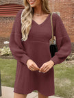 White V-neck knitted sweater dress with puff sleeves by FJØRNA, featuring a solid color design and cozy, stylish fit.