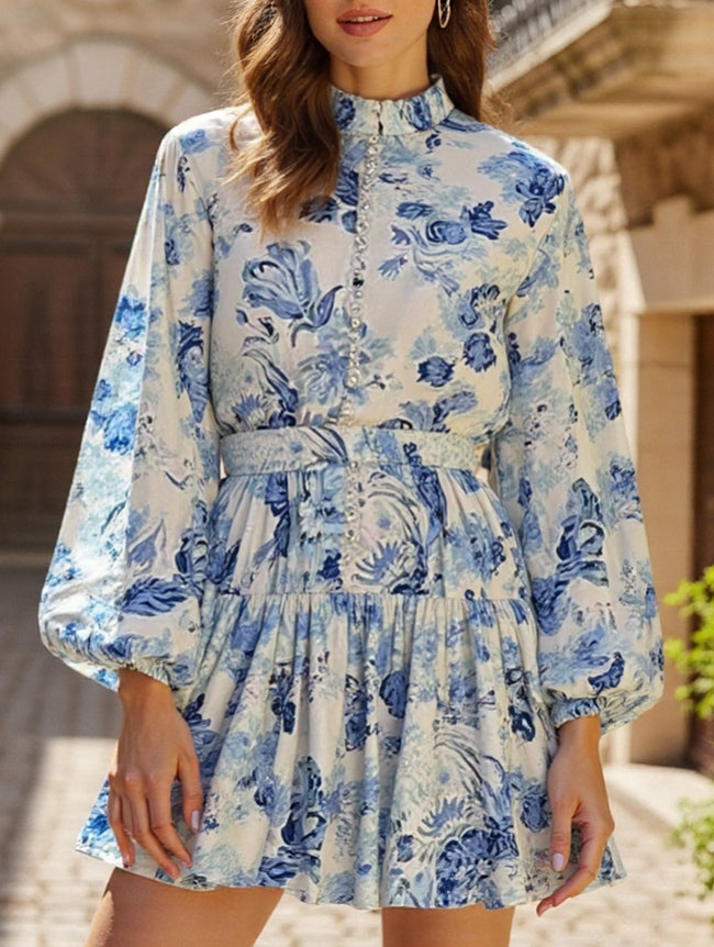 Blue FJØRNA long-sleeved tie-print dress with a stylish design, featuring a comfortable fit and elegant pattern.