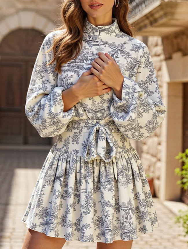FJØRNA long-sleeved tie-print white dress with a stylish design, perfect for fashionable occasions.
