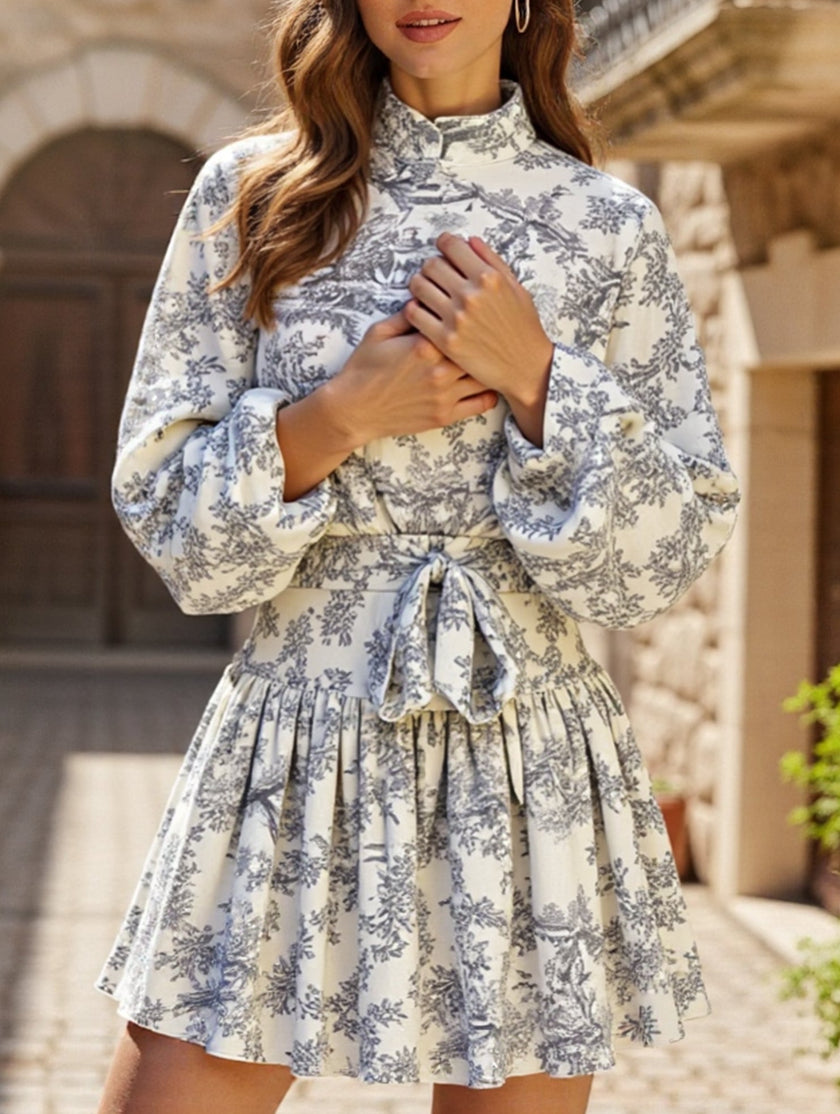 FJØRNA long-sleeved tie-print white dress with a stylish design, perfect for fashionable occasions.