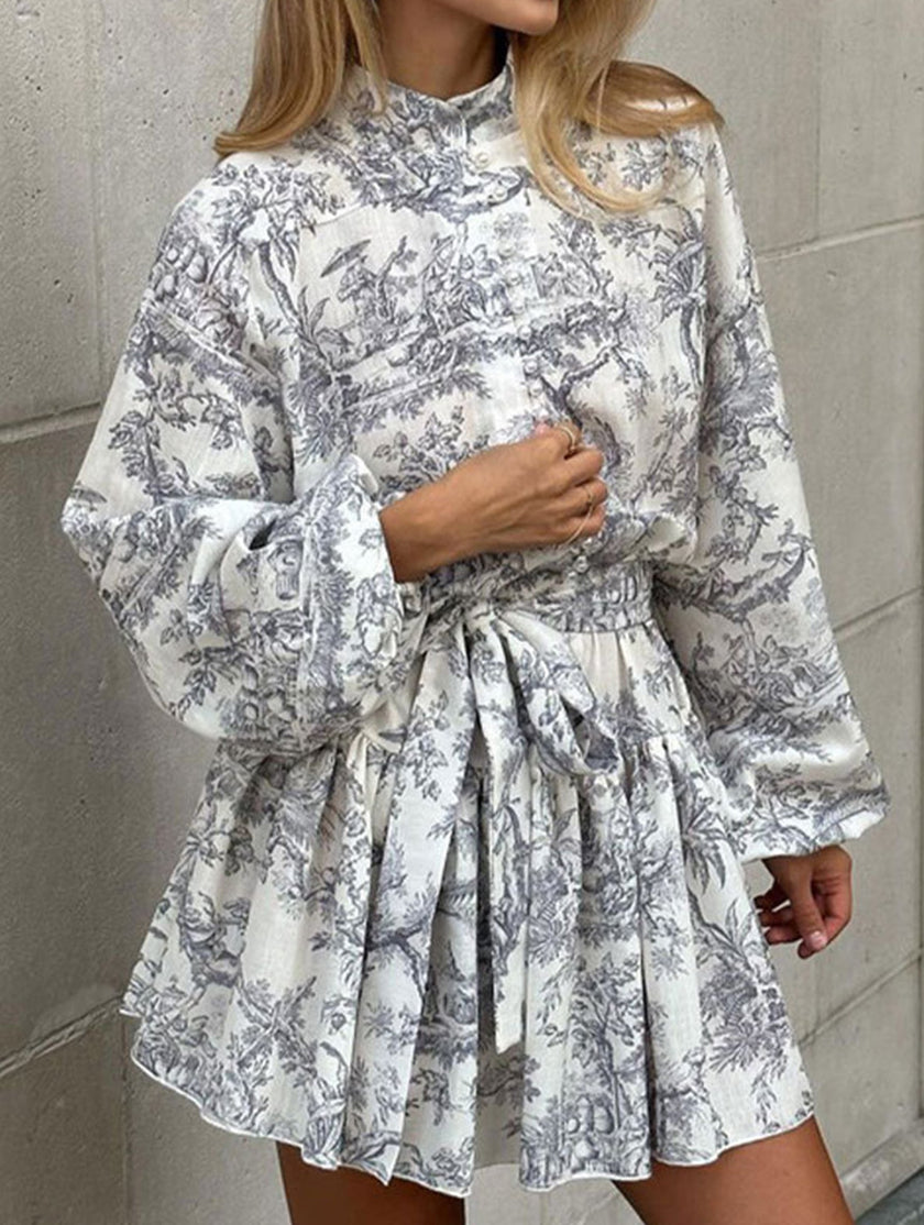FJØRNA long-sleeved tie-print white dress with a stylish design, perfect for fashionable occasions.