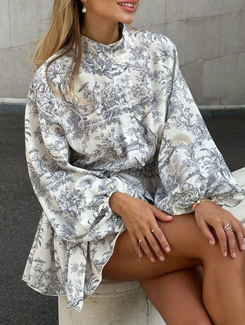FJØRNA long-sleeved tie-print white dress with a stylish silhouette, perfect for fashionable occasions.