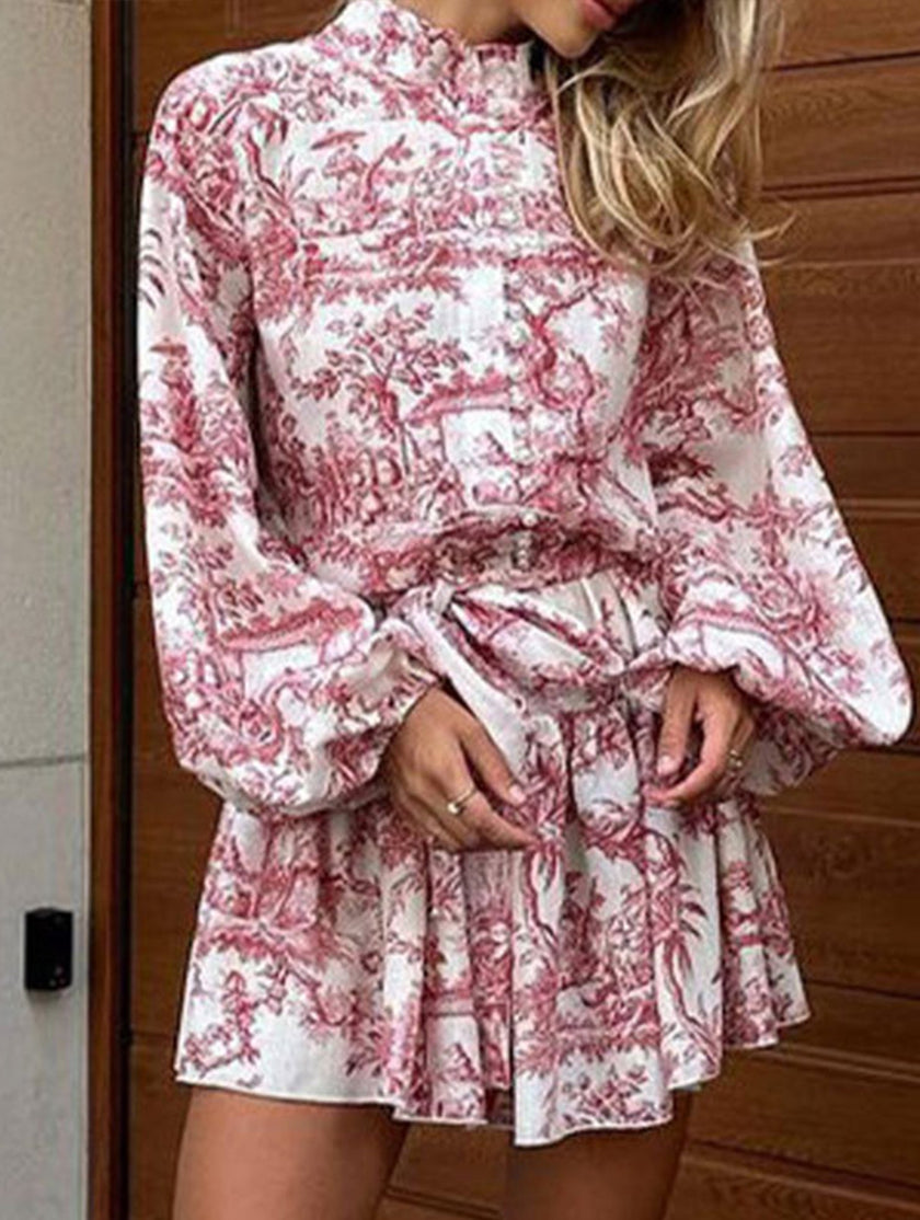 FJØRNA long-sleeved white tie-print dress featuring a stylish, flowing design perfect for fashionable occasions.