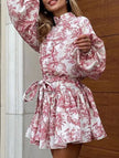 FJØRNA long-sleeved white dress with red tie-print pattern, stylish and elegant for fashionable occasions.