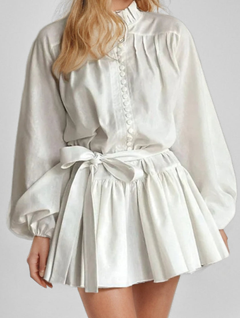 FJØRNA long-sleeved white tie-print dress with a stylish design, perfect for fashionable occasions.