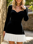 FJØRNA black and white heart-shaped dress with a classic design, featuring a fitted bodice and flared skirt for elegant style.