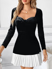 Black and white heart-shaped dress by FJØRNA, featuring classic design and elegant style, shown on a model.