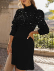 Black FJØRNA long-sleeved sweater dress with a solid color design, featuring a comfortable fit and casual style.