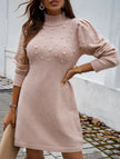 FJØRNA solid white long-sleeved sweater dress, casual fit, displayed on a model with a round neckline and ribbed cuffs.