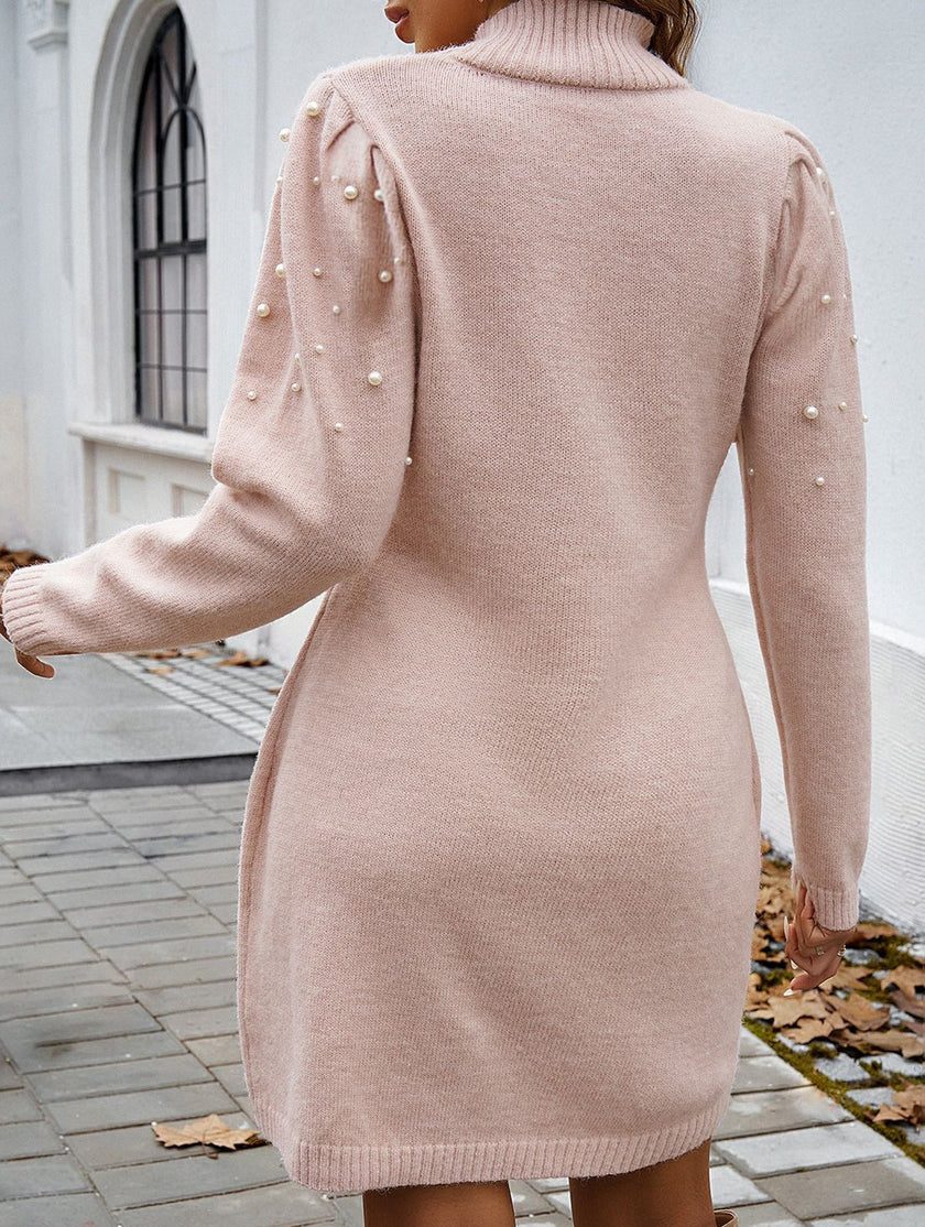 FJØRNA solid white long-sleeved sweater dress, cozy and stylish, displayed on a hanger against a plain background.