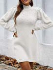 White FJØRNA long-sleeved sweater dress with a solid color design, featuring a soft knit fabric and a comfortable fit.