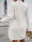 FJØRNA white long-sleeved sweater dress, solid color, knee-length with a fitted silhouette and crew neckline.