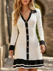 FJØRNA high-waisted white long-sleeved ruffle knit dress displayed on a model, showcasing its elegant design and fitted silhouette.