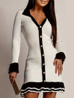 White FJØRNA high-waisted long-sleeved ruffle knit dress displayed on a model, showcasing its elegant design and fitted silhouette.