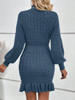 Navy cable knit waist-cinching sweater dress by FJØRNA, stylish and fitted with a cozy textured pattern and long sleeves.