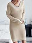 FJØRNA white lace V-neck knit dress, simple and elegant, displayed on a hanger with soft fabric details.