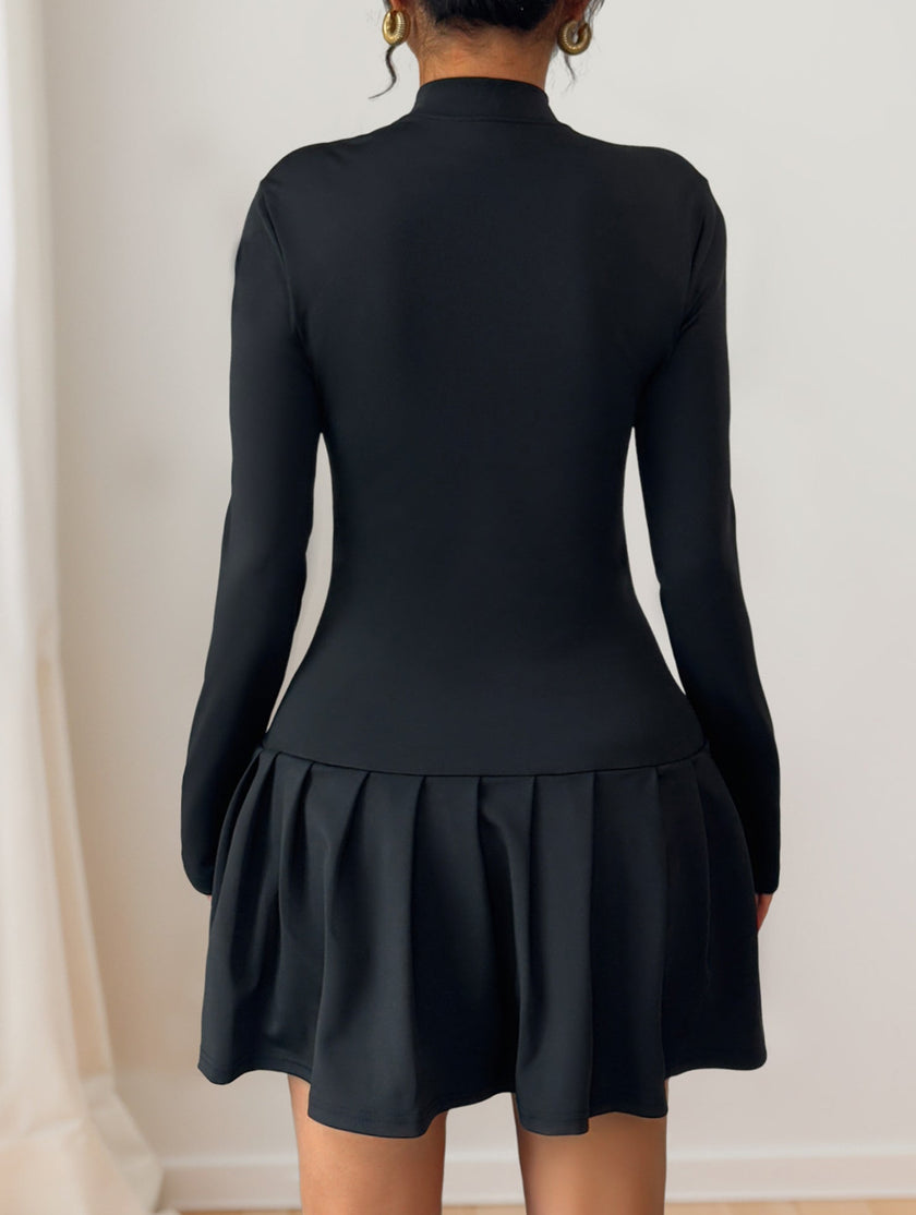 Black high-neck bow button dress by FJØRNA, featuring a stylish neckline and elegant design.