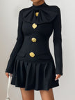 Black high-neck bow button dress by FJØRNA, featuring a stylish design with a fitted silhouette and elegant details.