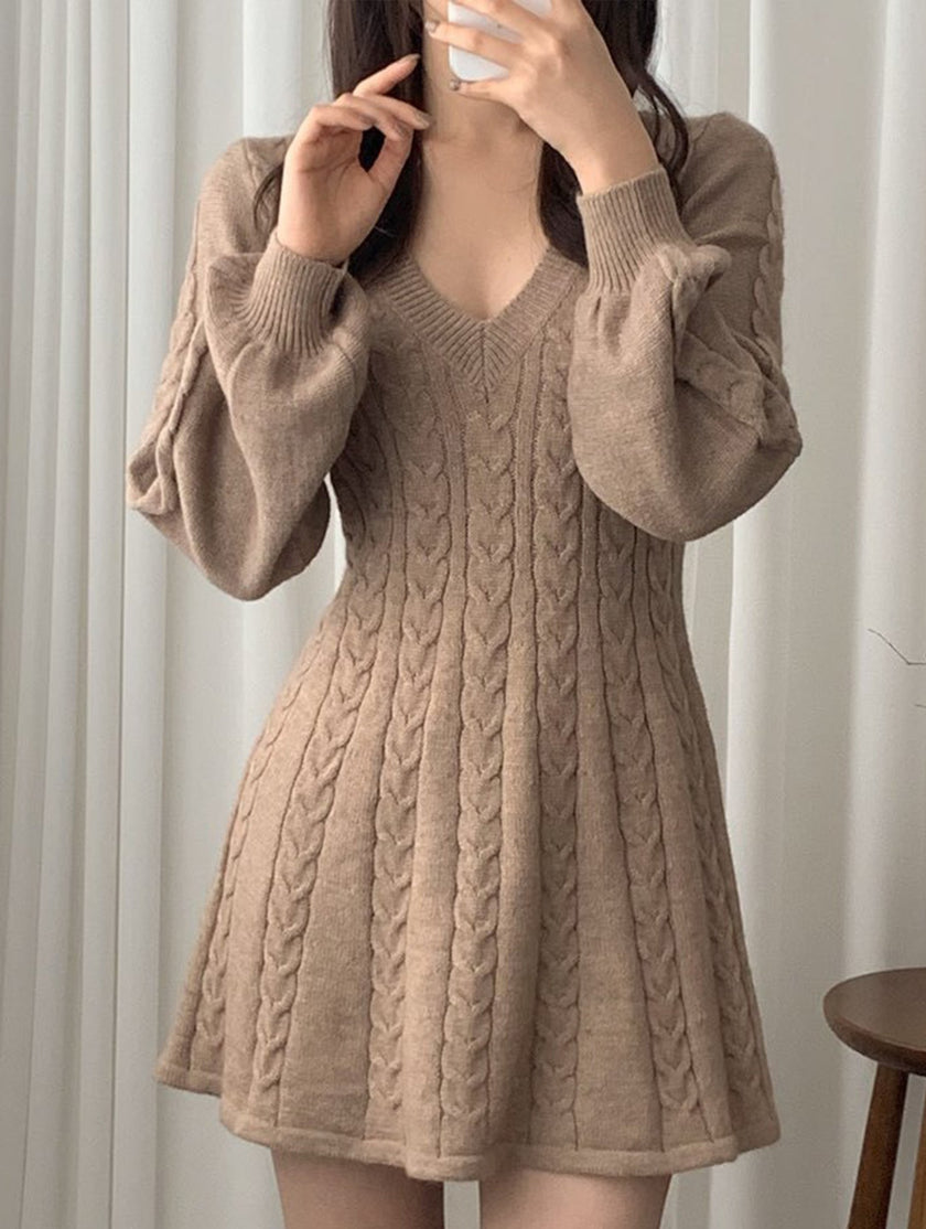 FJØRNA retro cable knit V-neck fitted dress in white, showcasing its textured knit fabric and classic silhouette.