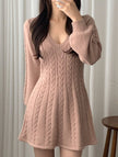 White FJØRNA retro cable knit V-neck fitted dress, showcasing a close-up of the textured knit and classic silhouette.