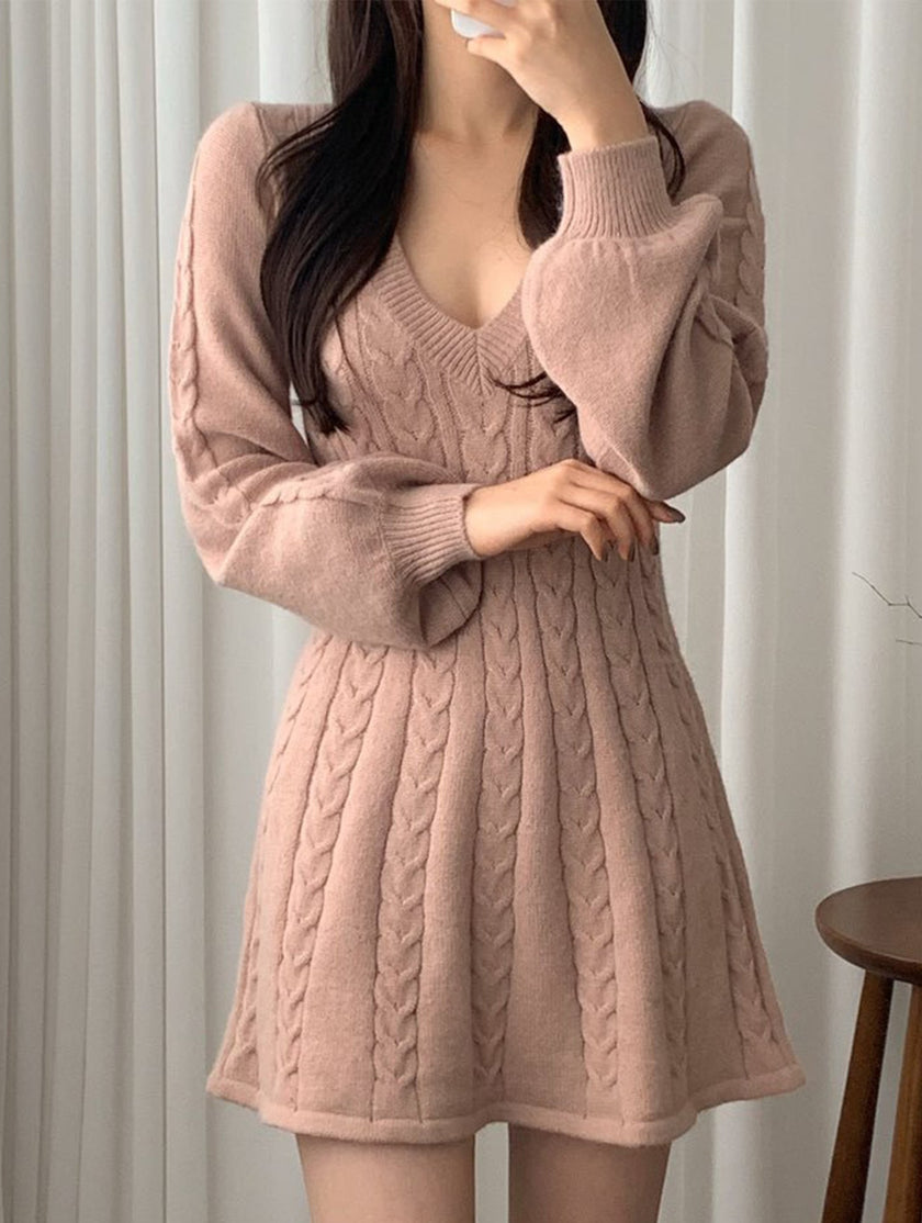 FJØRNA white retro cable knit V-neck fitted dress, stylish and cozy, displayed on a hanger against a neutral background.