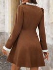 White high-neck single-breasted cardigan dress by FJØRNA, featuring a fitted silhouette and button details.