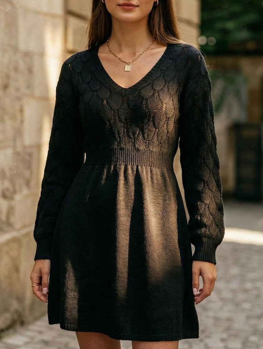 Black crochet V-neck A-line beach dress by FJØRNA, featuring a stylish, lightweight design perfect for summer outings.