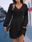 Black crochet V-neck A-line beach dress by FJØRNA, featuring a stylish and breathable design perfect for summer outings.