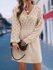 White crochet V-neck A-line beach dress by FJØRNA, featuring lightweight fabric and stylish design, perfect for summer outings.