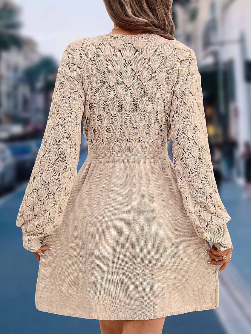 FJØRNA crochet V-neck A-line beach dress in white, featuring a relaxed fit and intricate crochet details for a breezy summer look.