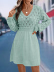 White crochet V-neck A-line beach dress by FJØRNA, showcasing a flowy, lightweight design perfect for seasidewear.
